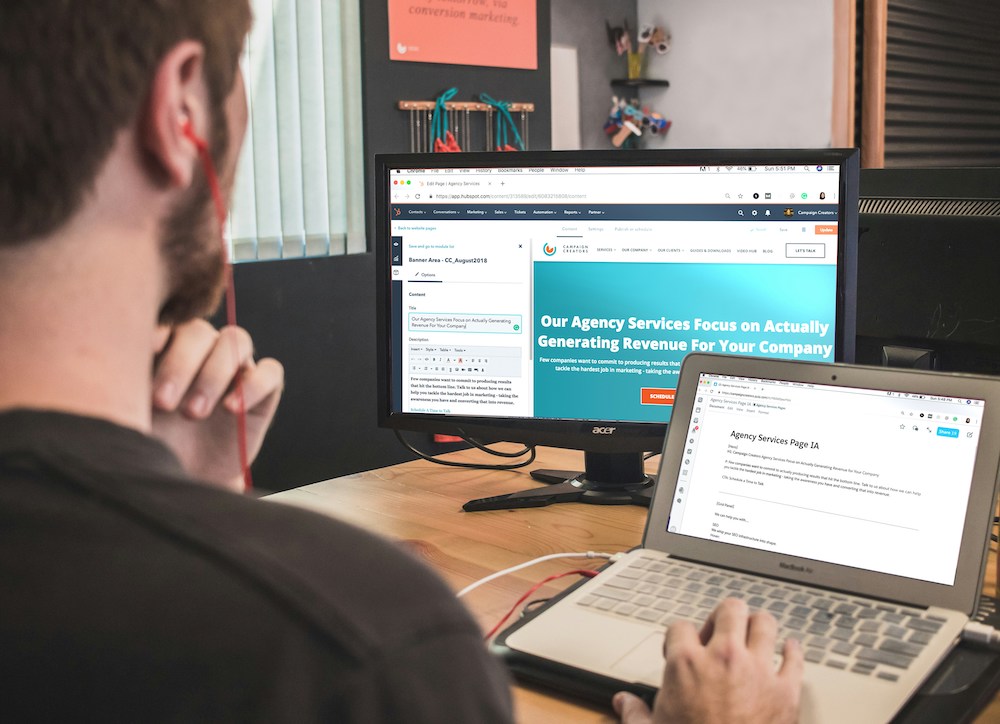 Man sitting at a desk working on a content campaign