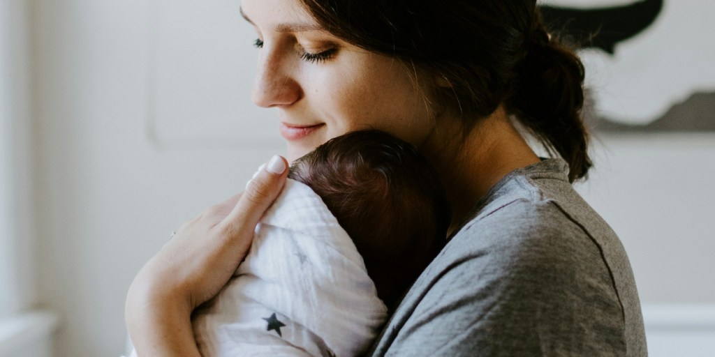A woman with her infant child